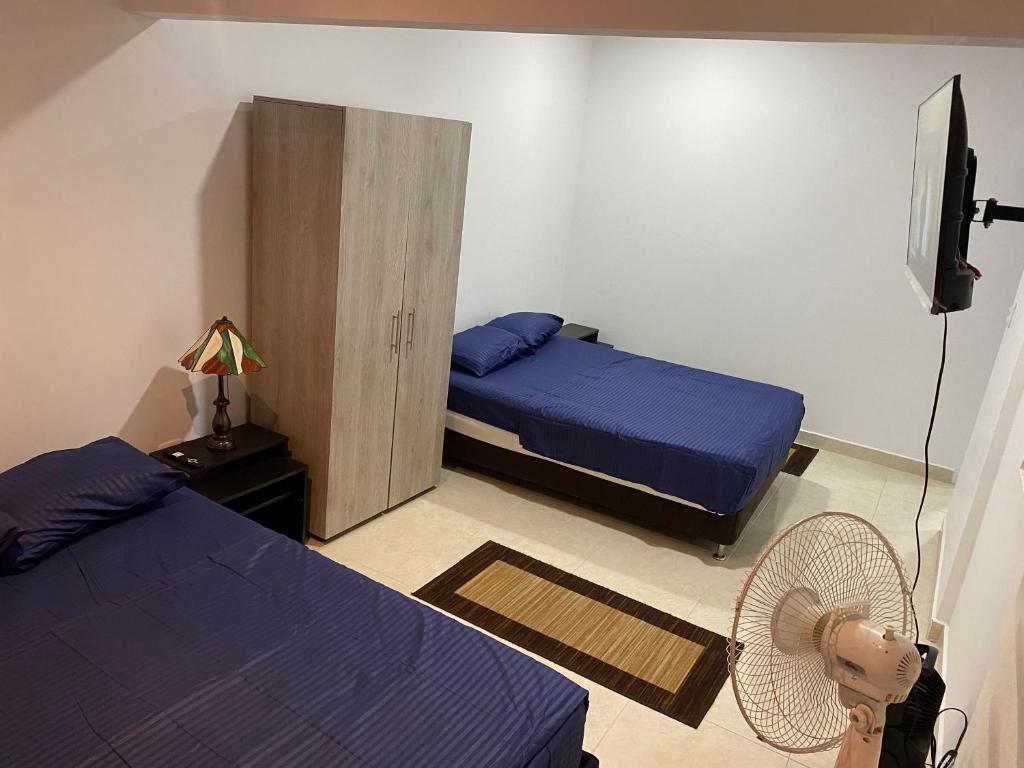 Postel nebo postele na pokoji v ubytování ApartaEstudios Viva, en la vega