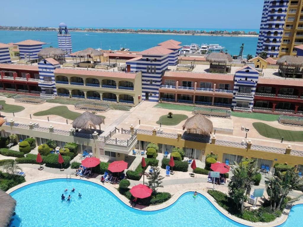 a view of a resort with a swimming pool at شاليه في بورتو مارينا للايجار in Abû Zeira