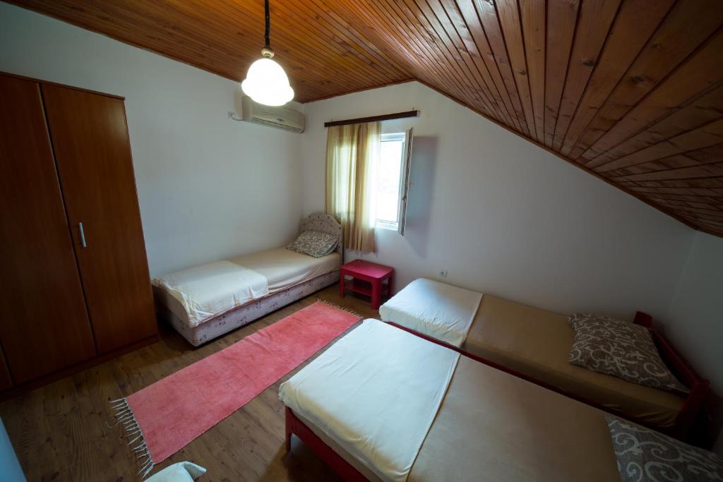 Postel nebo postele na pokoji v ubytování Apartments Pavićević