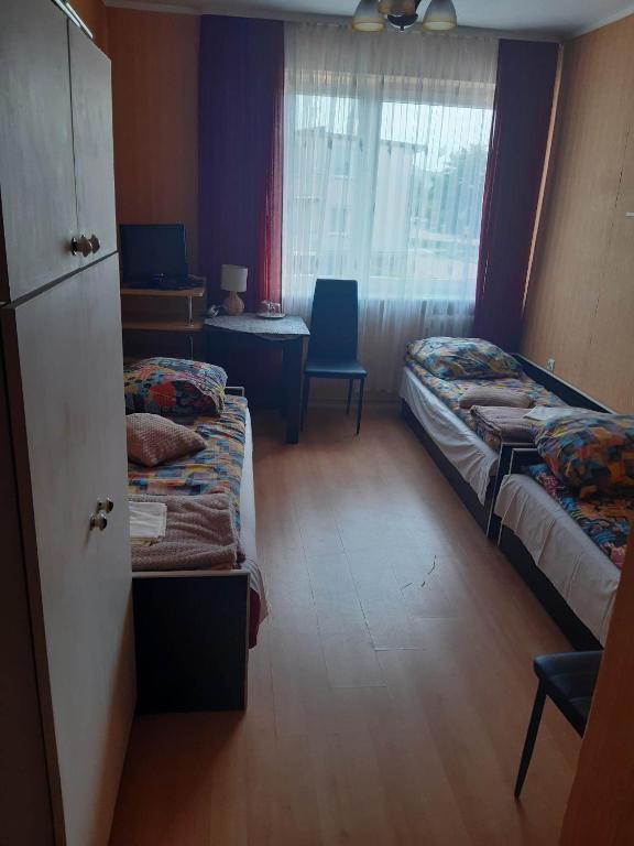 Postel nebo postele na pokoji v ubytování Ośrodek wczasowy Ewa