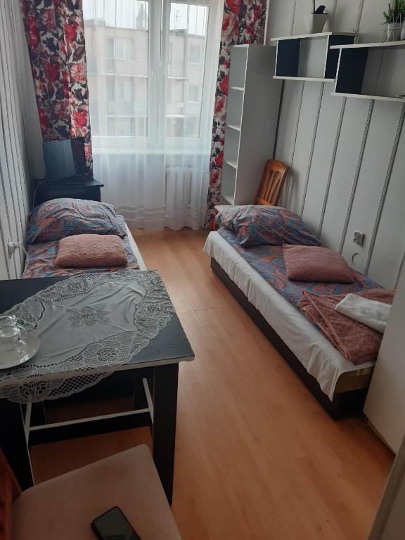 Postel nebo postele na pokoji v ubytování Ośrodek wczasowy Ewa