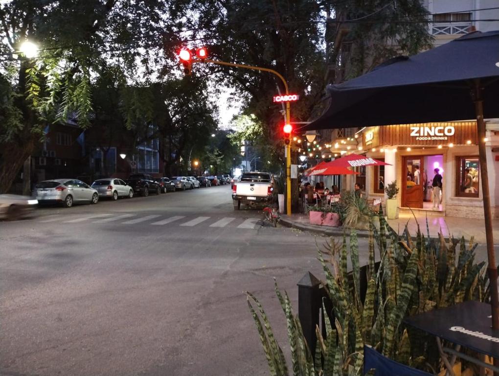 a red traffic light on a city street at night at Departamento Centro de Santiago del Estero in Santiago del Estero