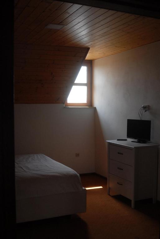 Postel nebo postele na pokoji v ubytování Penzion Na Náměstí