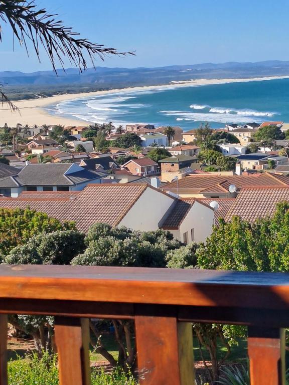 a view of a town with houses and the ocean at A1 Kynaston self catering or bed and breakfast solarpower in Jeffreys Bay