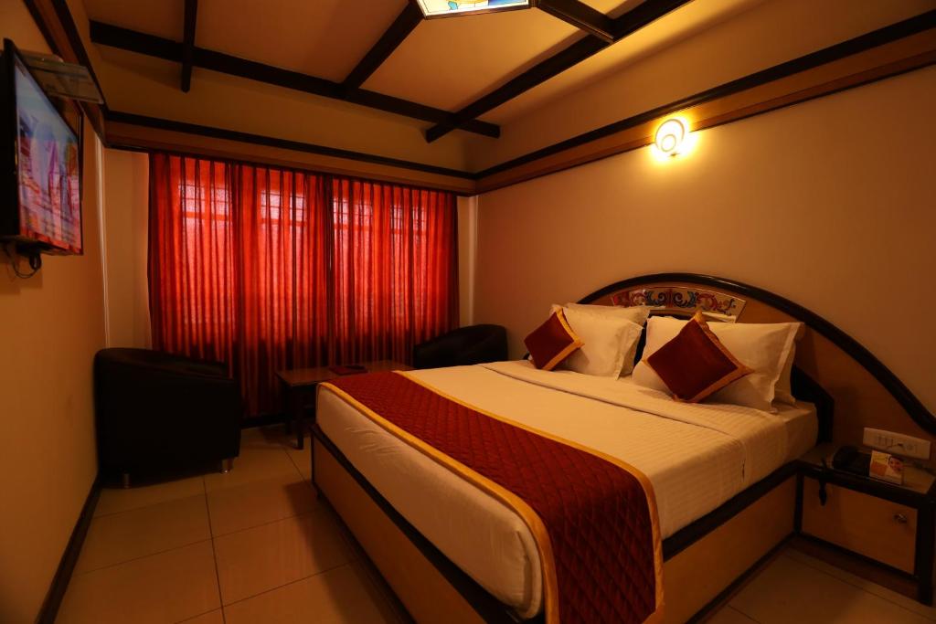 Postel nebo postele na pokoji v ubytování Hotel Silver Oak
