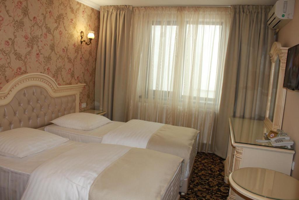 Postel nebo postele na pokoji v ubytování Hotel Orient Braila
