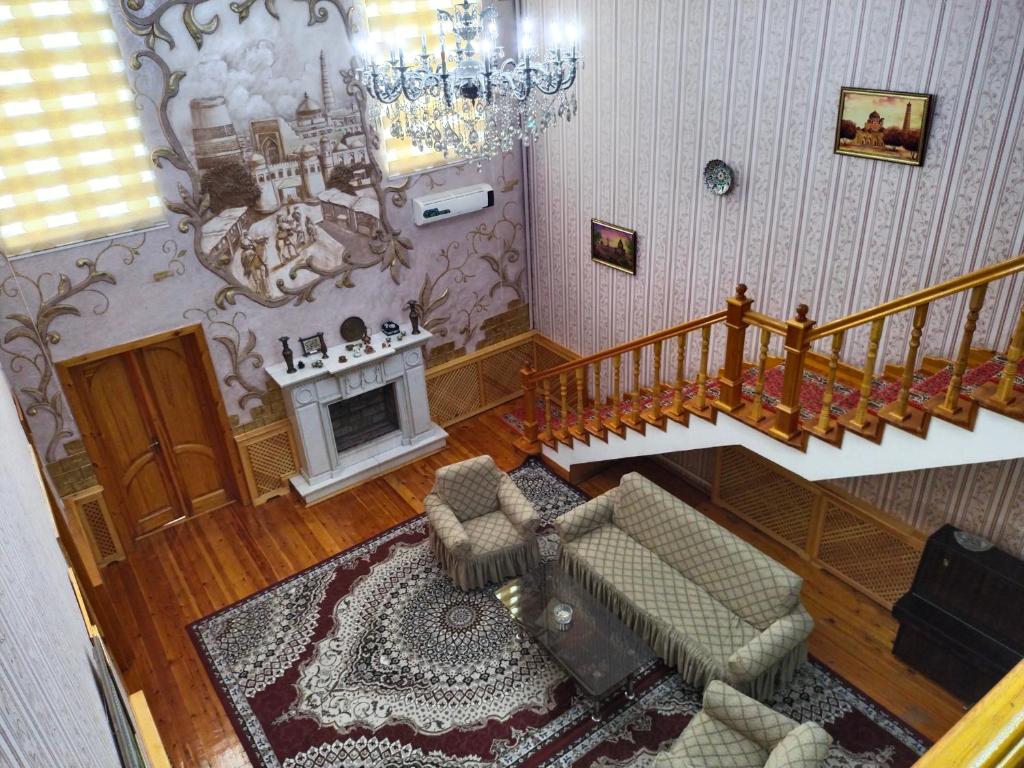 an overhead view of a living room with a staircase at Sulton-Sayyor in Khiva