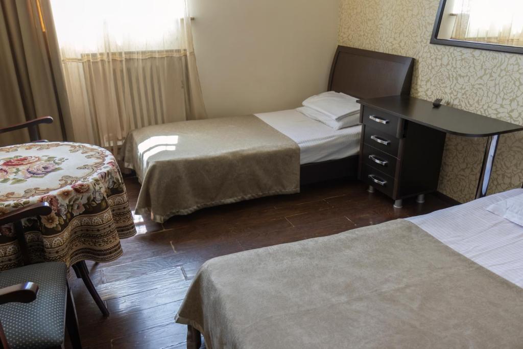 Postel nebo postele na pokoji v ubytování Parvana Hotel