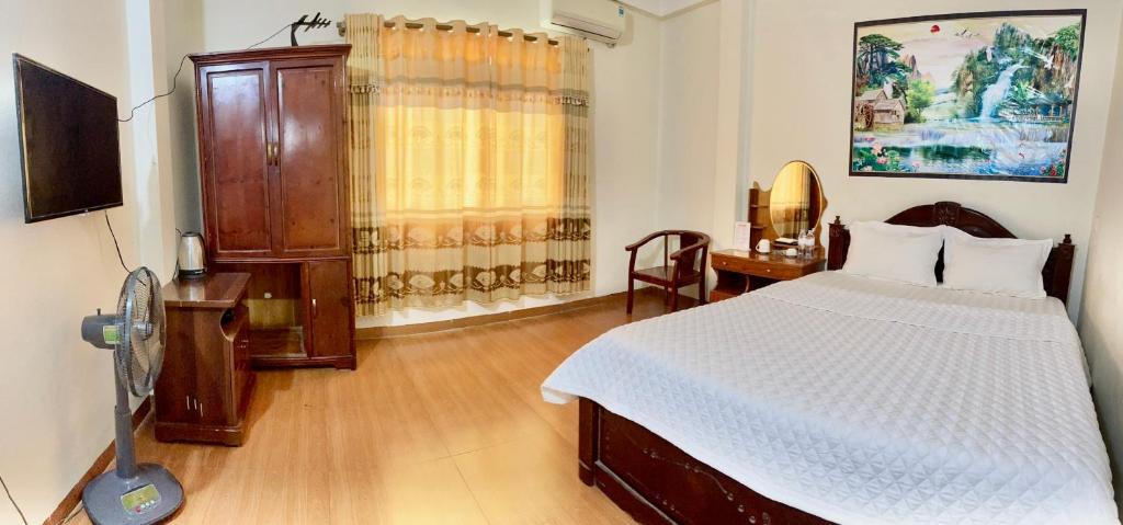 Postel nebo postele na pokoji v ubytování Van Anh Hotel