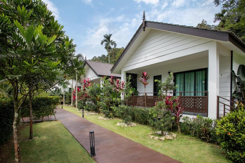 a house with a pathway in front of it at Villa Renai Resort in Bentong