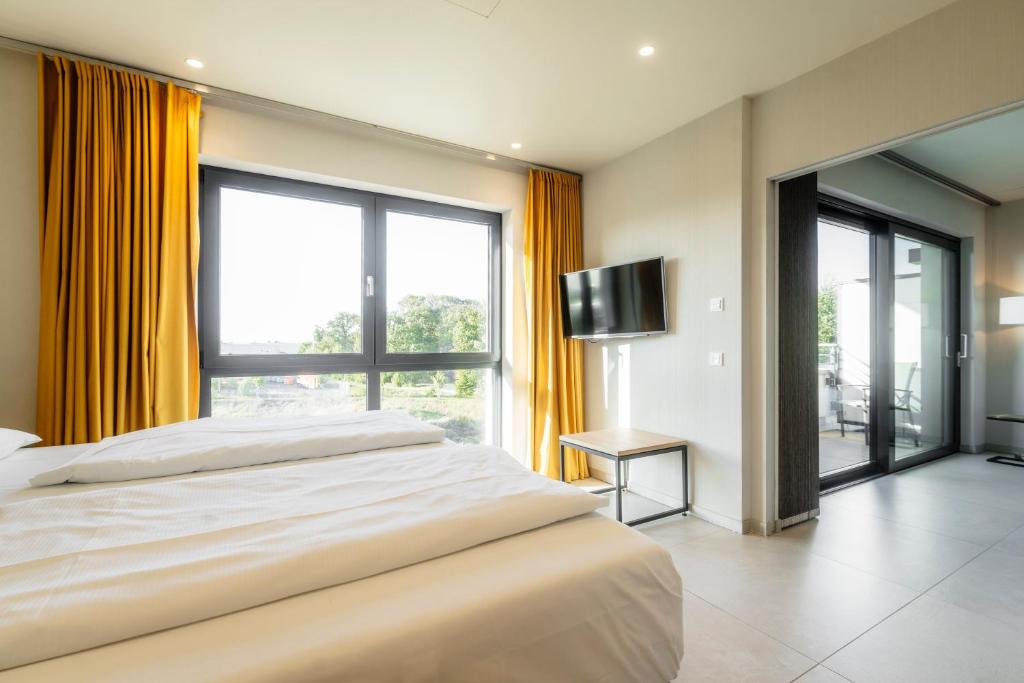 Postel nebo postele na pokoji v ubytování i - PARK Hotel Reichenberg