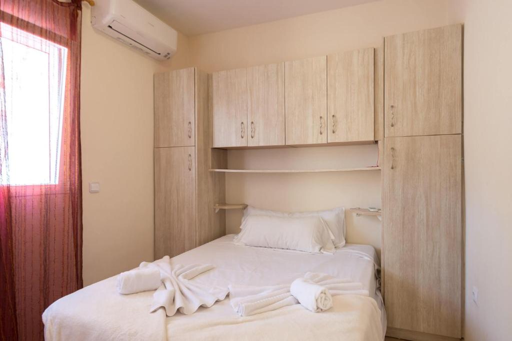 a bedroom with a bed with white towels on it at Villa Inia - PlusHolidays in Calpe