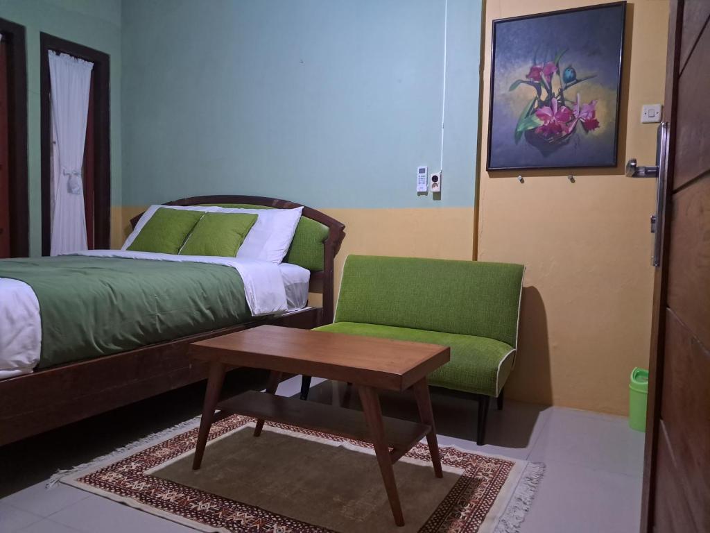Postel nebo postele na pokoji v ubytování Griya Jene Homestay Syariah