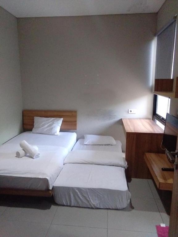 Llit o llits en una habitació de M Pavilion - BSD