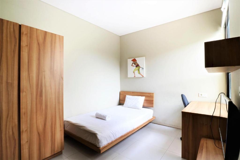 Llit o llits en una habitació de M Pavilion - BSD