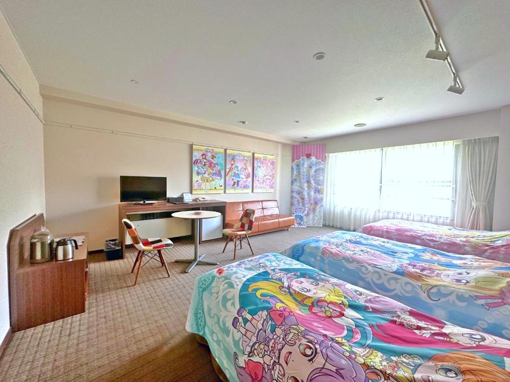 Postel nebo postele na pokoji v ubytování Yuzawa Toei Hotel