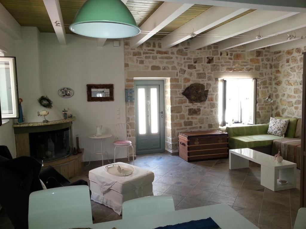 a living room with a couch and a fireplace at Lavinia in Gaios