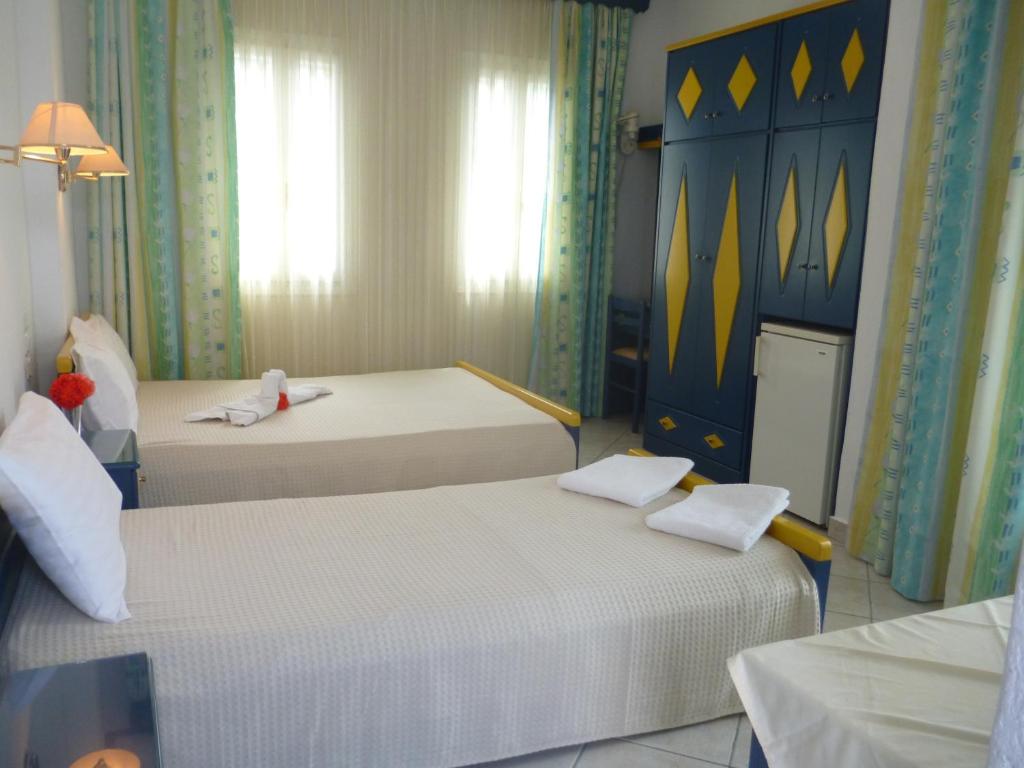 Postel nebo postele na pokoji v ubytování Galini Hellenic Hospitality