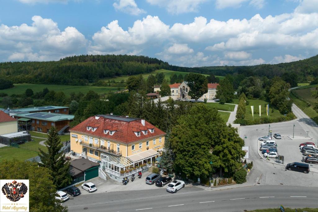 an aerial view of a town with a large building at Hotel Mayerling in Mayerling