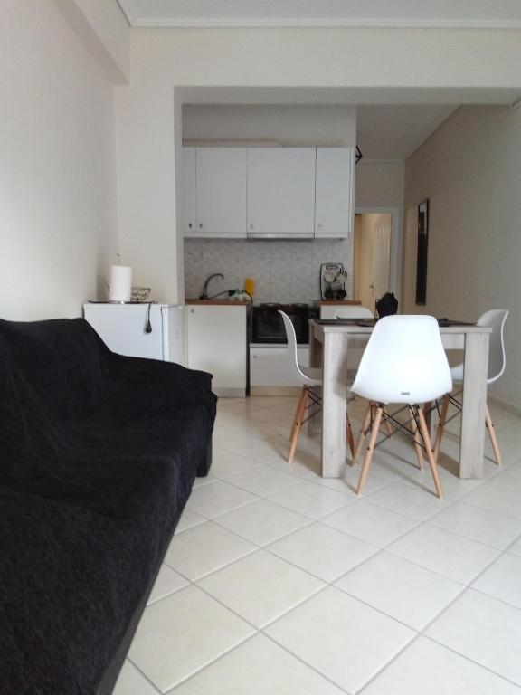 a living room with a couch and a table at Olga & Dimitris in Kalamata