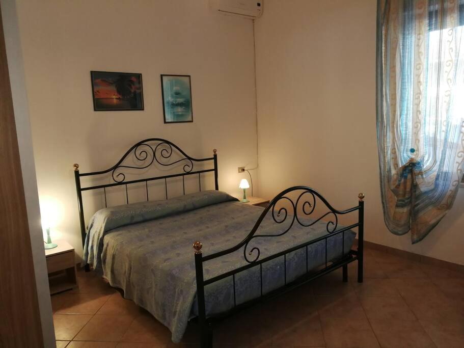 Postel nebo postele na pokoji v ubytování Casa vacanze Mandriola Putzuidu Capo Mannu