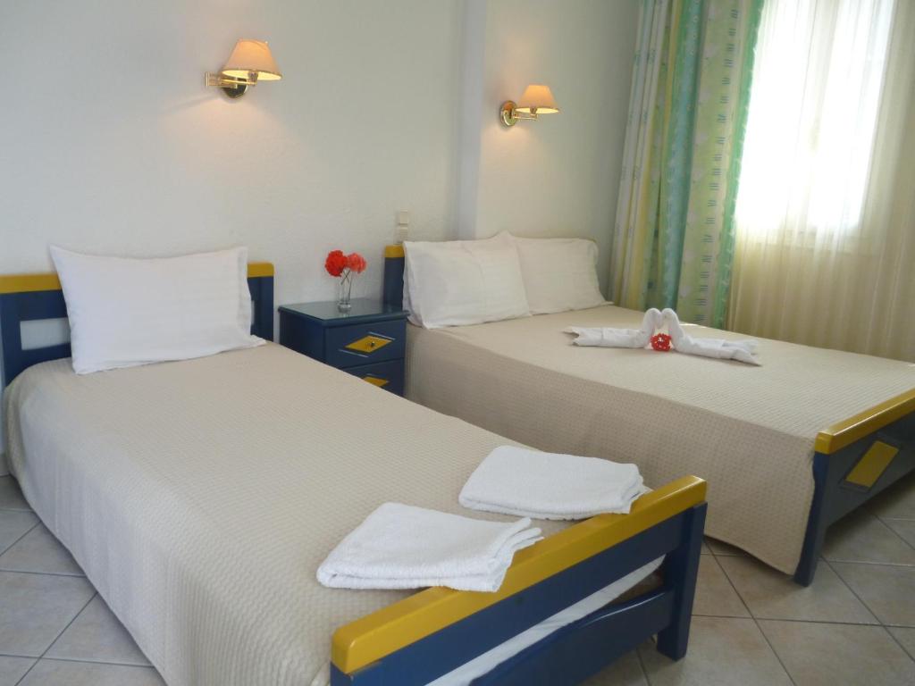 Postel nebo postele na pokoji v ubytování Galini Hellenic Hospitality