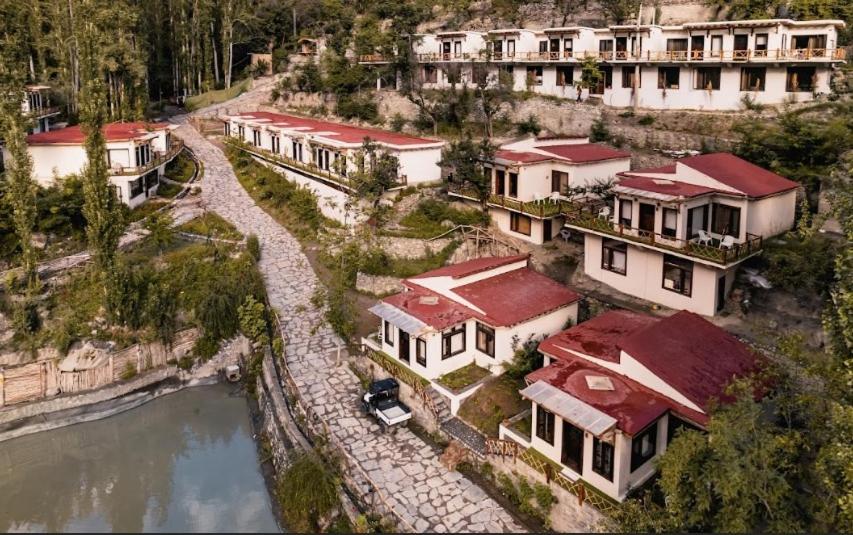 an aerial view of a house next to a river at Offto Resort Hunza in Hunza