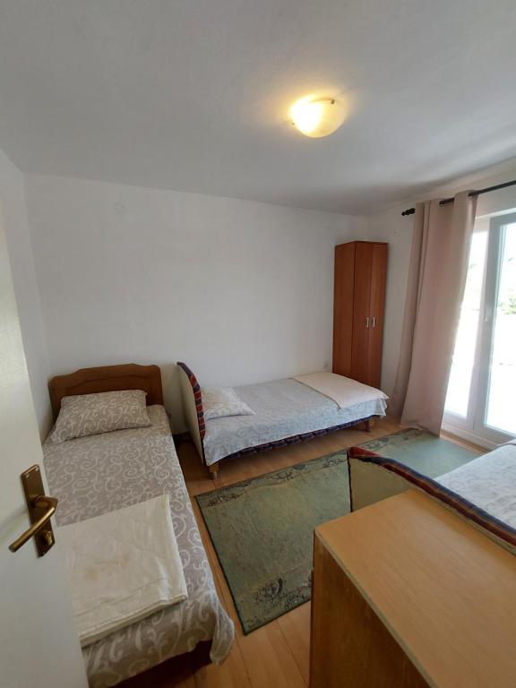 Säng eller sängar i ett rum på Mira Apartment Igalo