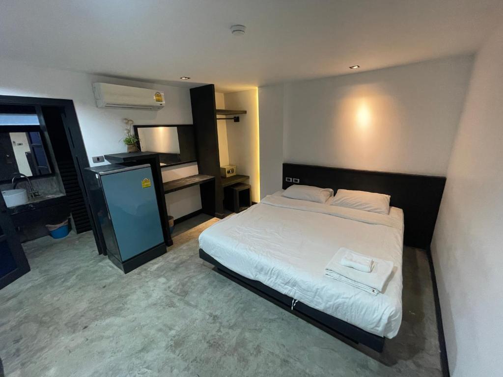 Postel nebo postele na pokoji v ubytování Islanda Hotel Patong