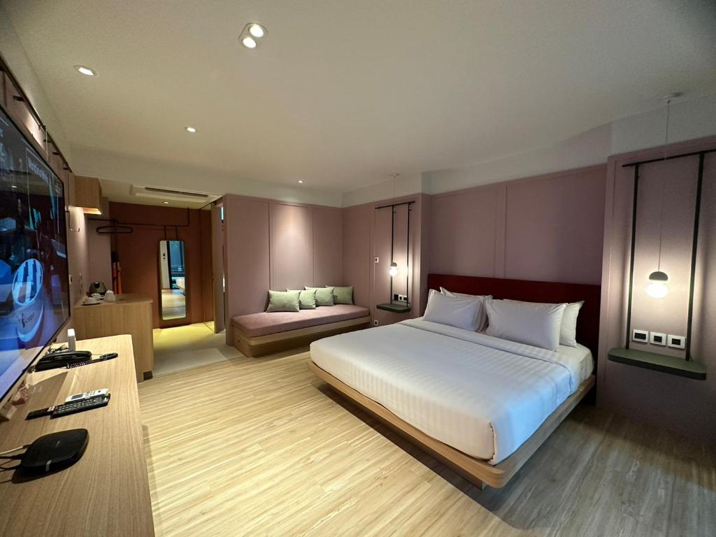 Postel nebo postele na pokoji v ubytování Banlansuan Resort SHA Plus