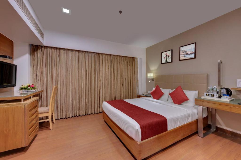 Postel nebo postele na pokoji v ubytování Hotel Suba Star Ahmedabad
