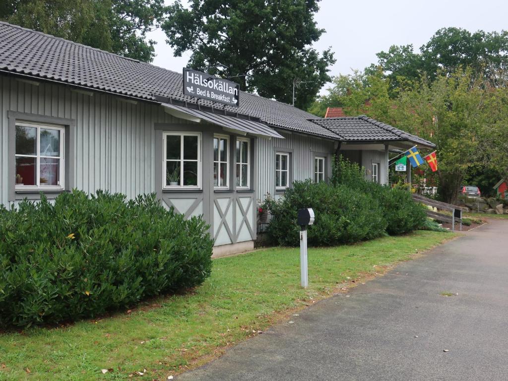 a building with a parking meter in front of it at Hälsokällans Bed and Breakfast in Kyrkhult