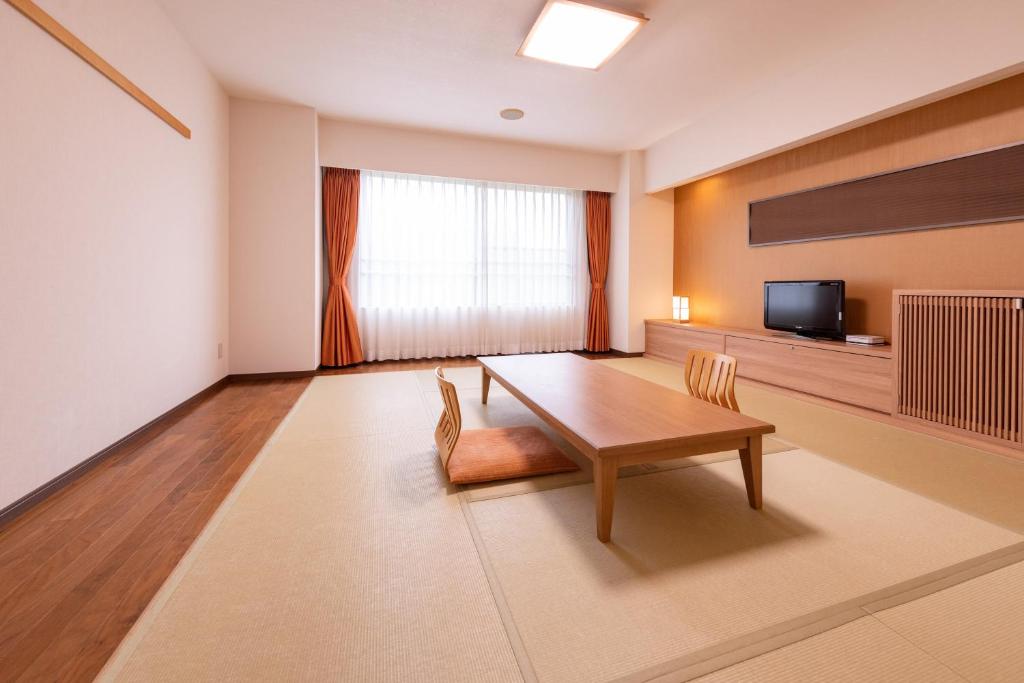 TV a/nebo společenská místnost v ubytování Yuzawa Toei Hotel