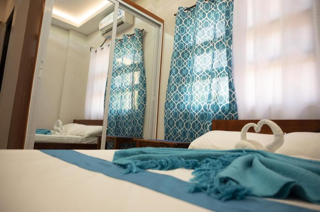 Postel nebo postele na pokoji v ubytování La Jose Beach Resort