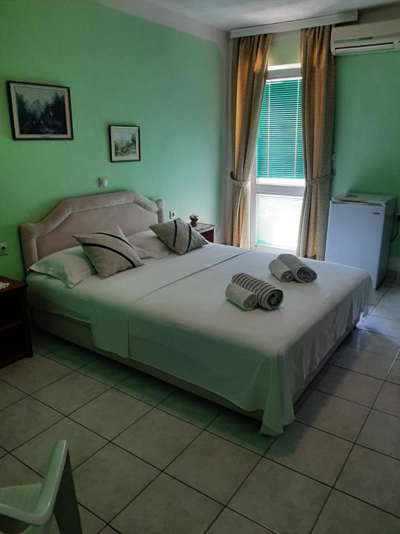 Postel nebo postele na pokoji v ubytování Guest House Aldin