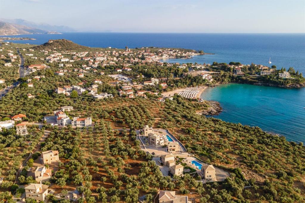 an aerial view of a town on the shore of the ocean at Dream Villas Stoupa in Stoupa