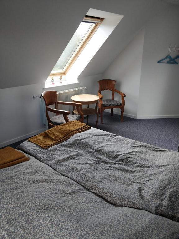 Postel nebo postele na pokoji v ubytování Kristinebjerg