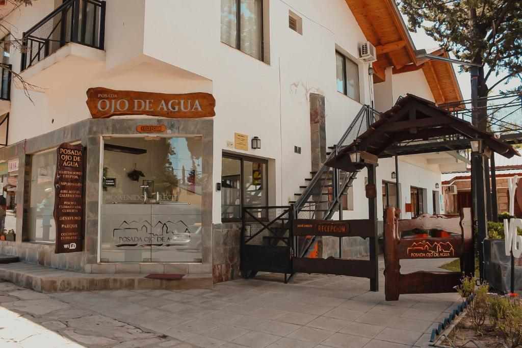a store with a sign on the side of a building at Posada Ojo de Agua Villa General Belgrano in Villa General Belgrano
