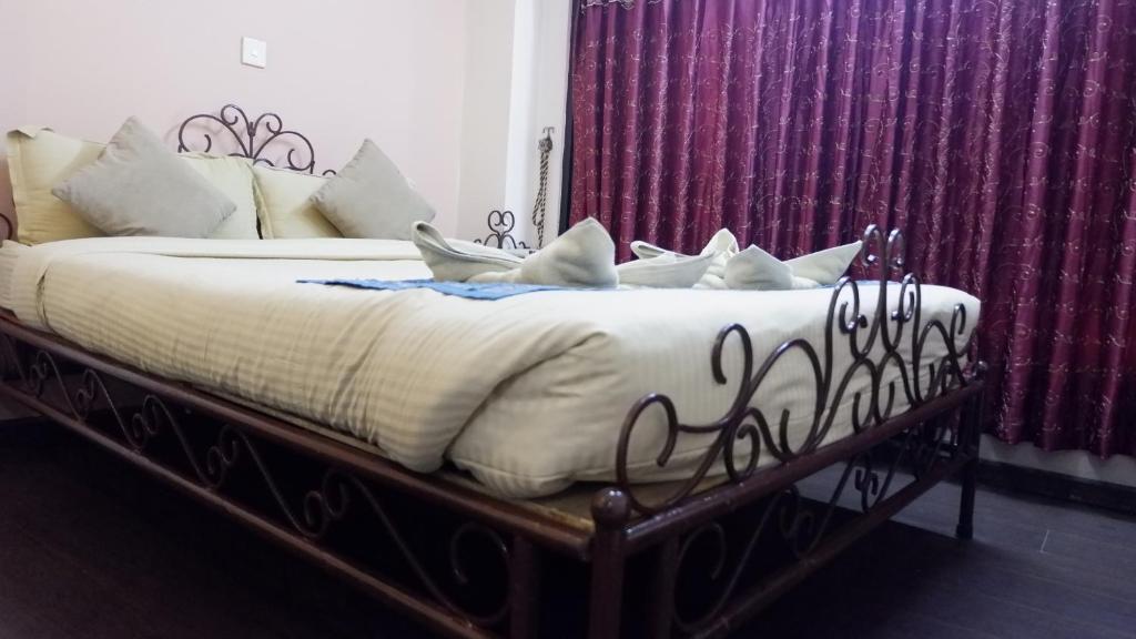Postel nebo postele na pokoji v ubytování Cosy Hotel