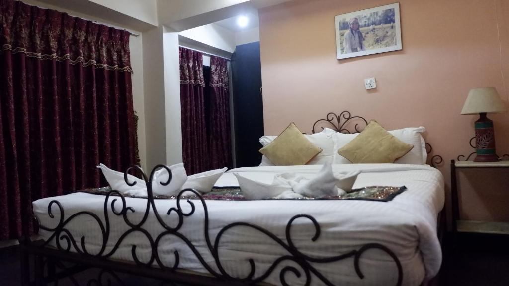 Postel nebo postele na pokoji v ubytování Cosy Hotel