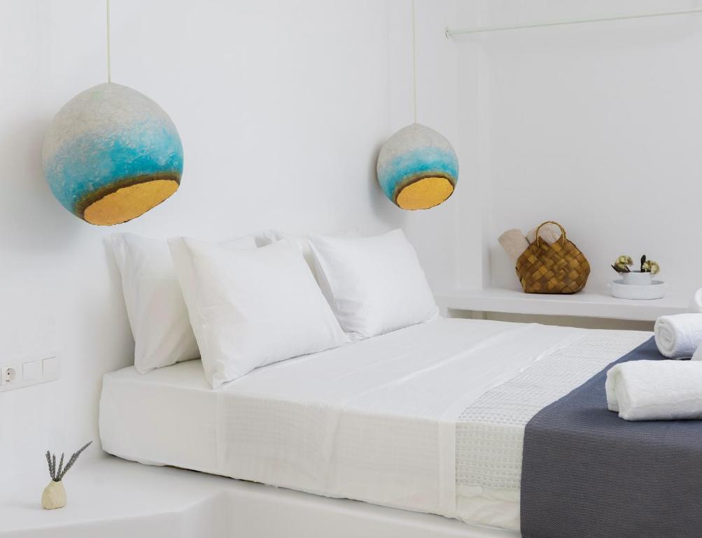 Postel nebo postele na pokoji v ubytování VOCA HOTEL & SUITES