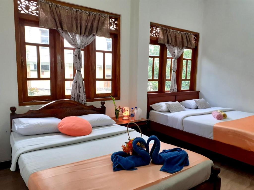 Postel nebo postele na pokoji v ubytování Subash Hotel