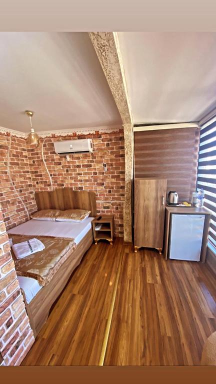 Postel nebo postele na pokoji v ubytování GOLDEN ARROW OLD CİTY HOTEL