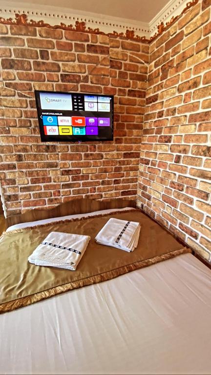 Postel nebo postele na pokoji v ubytování GOLDEN ARROW OLD CİTY HOTEL