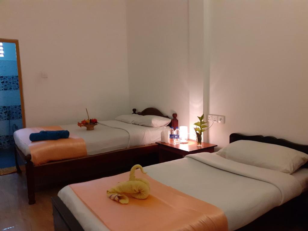 Postel nebo postele na pokoji v ubytování Subash Hotel
