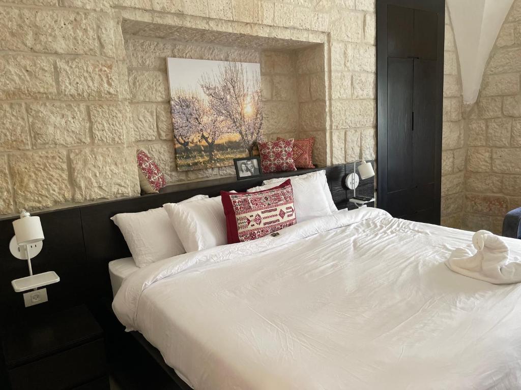 Mizirawi Historic Hotel tesisinde bir odada yatak veya yataklar