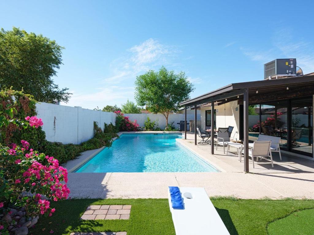 a swimming pool in a yard with a house at Stay Golden in Tempe