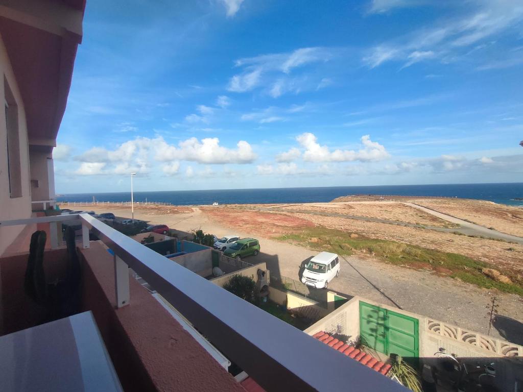 a view of the ocean from a balcony of a building at Burrero Seasight in Ingenio