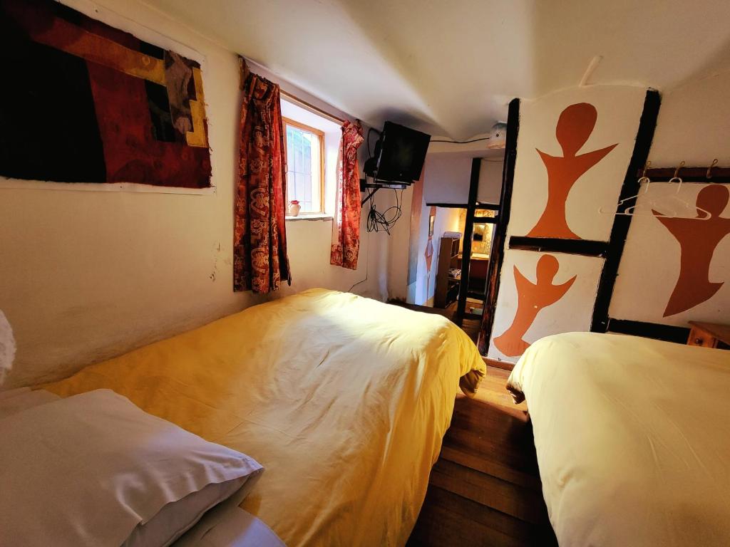 Postel nebo postele na pokoji v ubytování La Casa de Campo