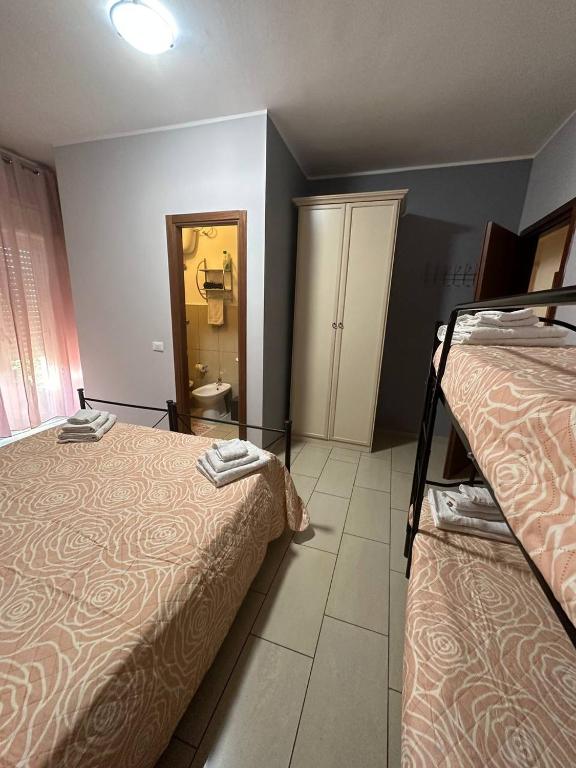 Postel nebo postele na pokoji v ubytování B&B Emmanuel